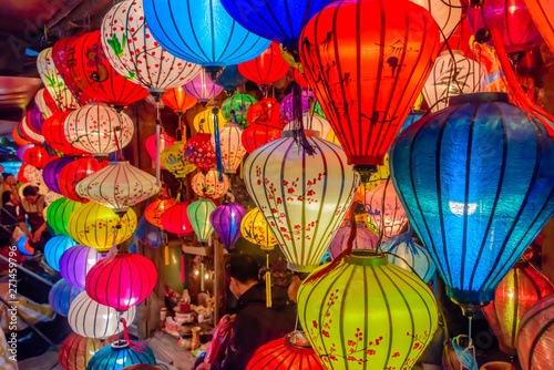 Colourful cloth lanterns lamp light shades hanging outside in Hoi An, Vietnam