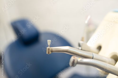 a dental tools for polishing teeth in the dental clinic in the background blurred chair for the patient