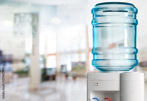 Plastic Water cooler over nature background photo
