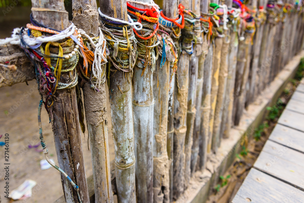 Colourful bracelets left by visitors at the site of a mass grave, Choeung  Ek Killing Fields Genocide Centre, Phnom Penh, Cambodia Stock Photo | Adobe  Stock