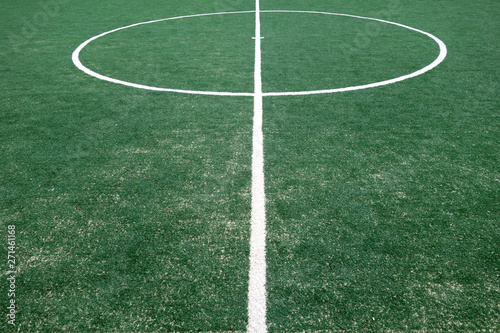 Fragment of footbal field with artificial grass. © pavelalexeev