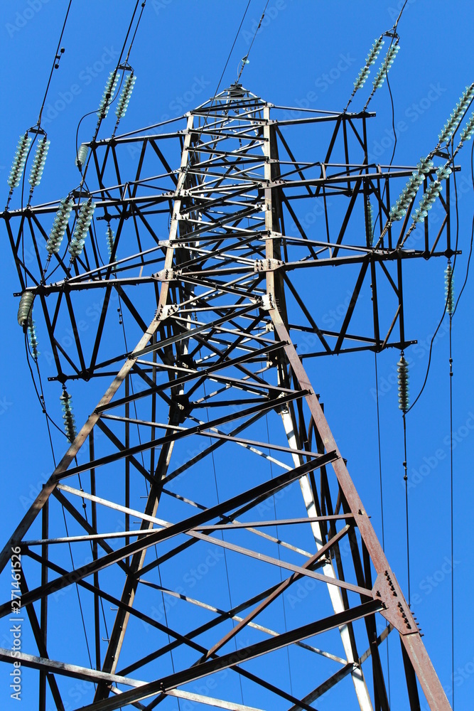Power line against a blue sky Power line against a blue sky