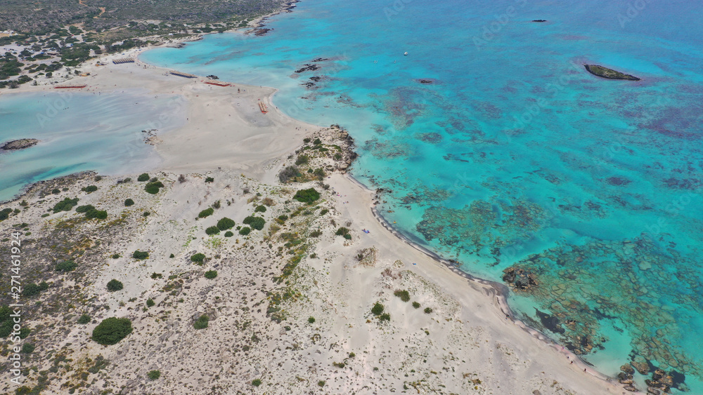 Obraz premium Aerial top view photo of men practising wind surfing in exotic paradise open ocean bay with crystal clear turquoise sea