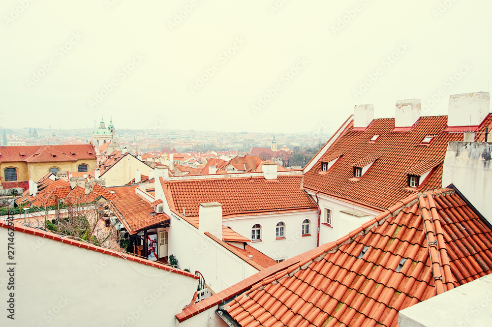 Travel and architecture. Cityscape with red tiled roofs view. Prague, Czech Republic.