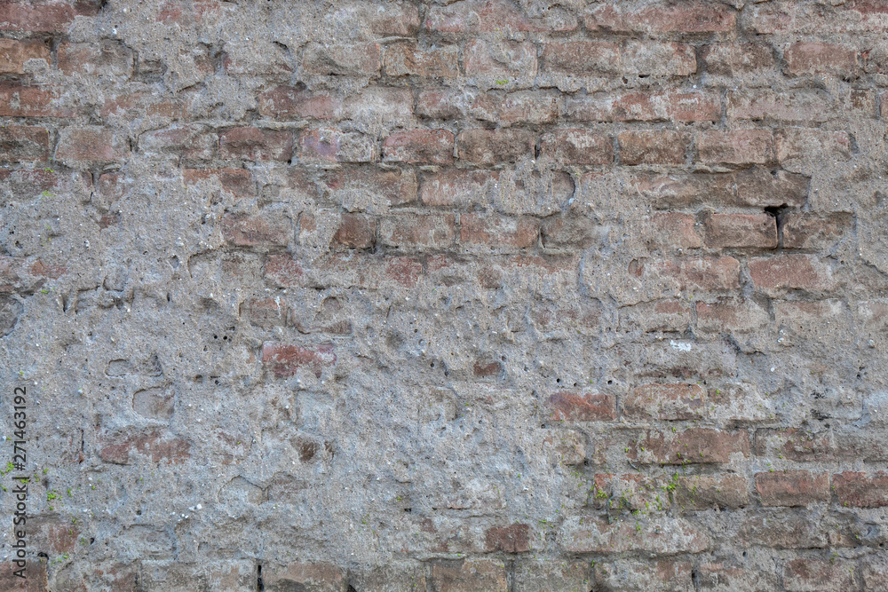 Old Weathered Brick Wall Covered With Concrete Old Weathered Brick Wall Covered With Concrete