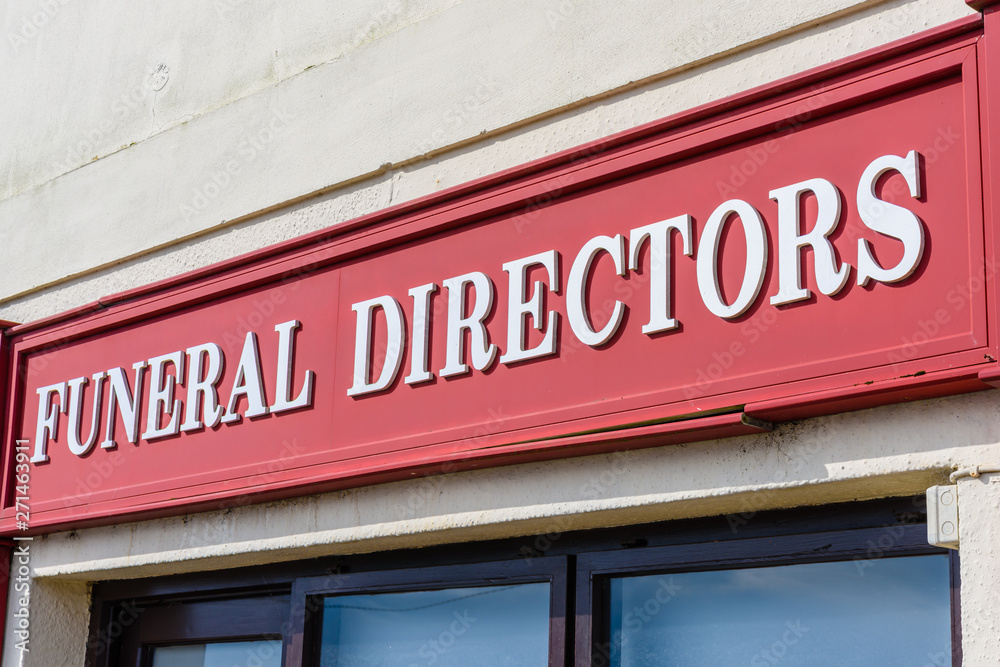 Sign outside a funeral directors funeral home. Sign outside a funeral directors funeral home.