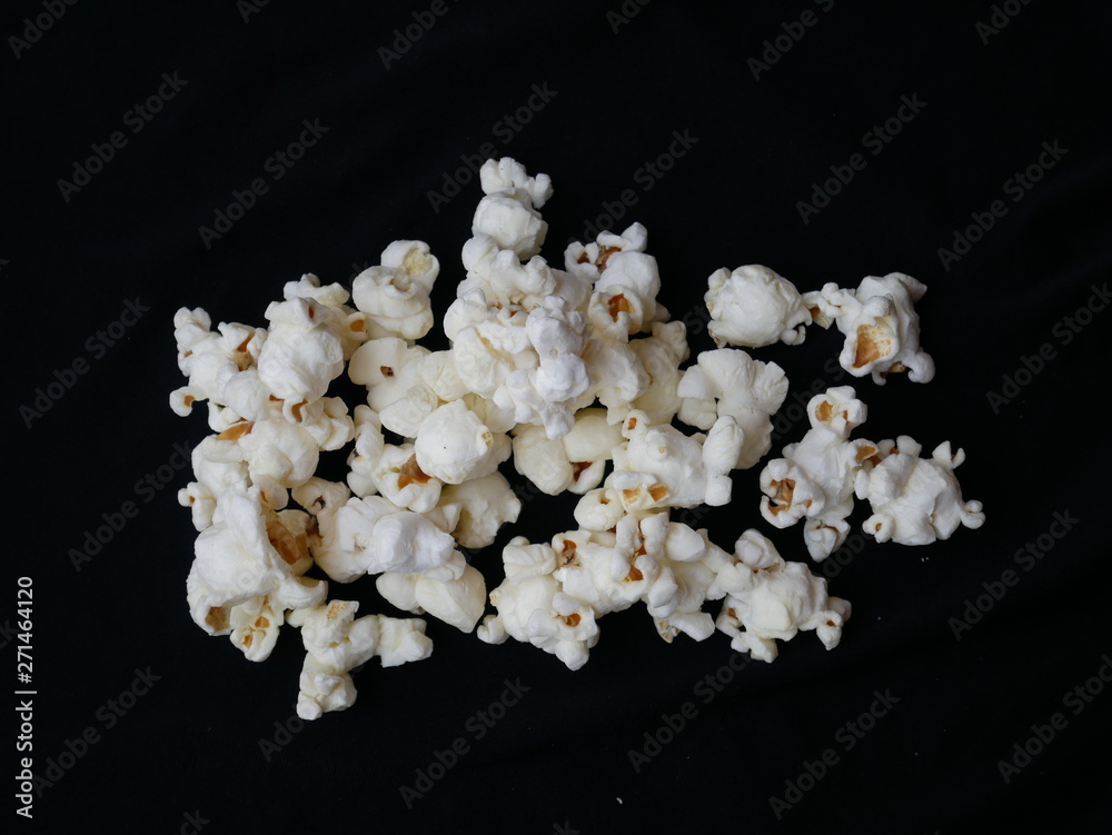 closeup pop corn isolated black background