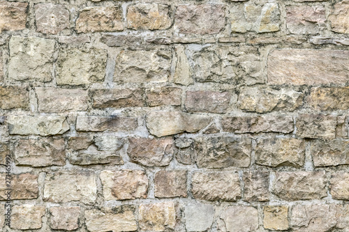 Fragment of an old stone fortress wall for use as an abstract background and texture.