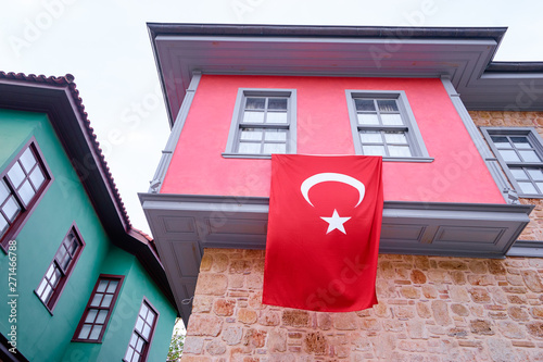 National flag of Turkey on facade of building in Kaleici, Antalya. photo