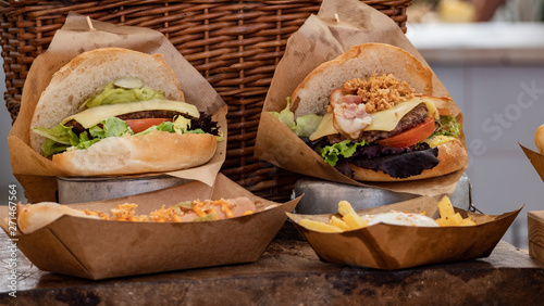Photography Burger display stacked street food sandwich, closeup, melted cheese and bun on b