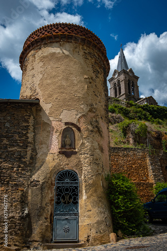 Round building with Lamothe church behind photo