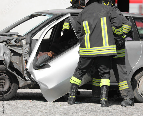 Tablou pe pânză broken door of car after accident and firemen