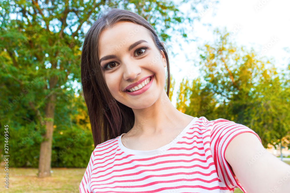 Beautiful urban woman taking picture of herself, selfie Beautiful urban woman taking picture of herself, selfie
