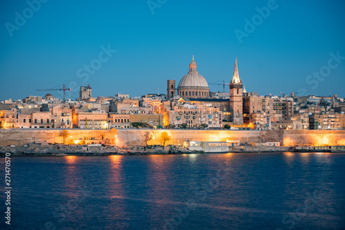 Panoramic view of Valletta Skyline at beautiful sunset from Sliema with churches of Our Lady of Mount Carmel and St. Paul's Anglican Pro-Cathedral, Valletta, Capital city of Malta © martinscphoto