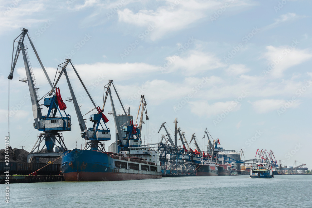 Ships in Sea port with cranes, rails