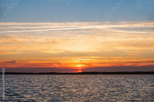 Grand sunset on the lake in the summer. Lake Svityaz in Ukraine. Ukrainian nature. Copy space. © Ganna Zelinska