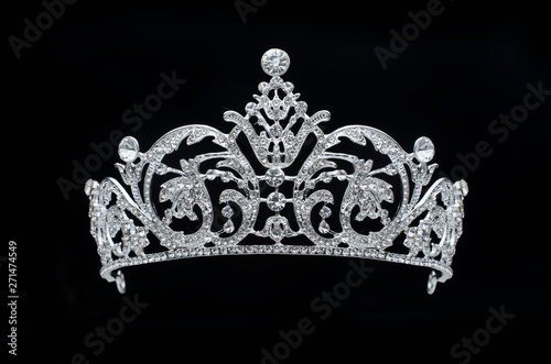 silver tiara with diamonds on black background