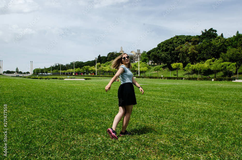 young woman having fun , jumping, rolling and smiling young woman having fun , jumping, rolling and smiling