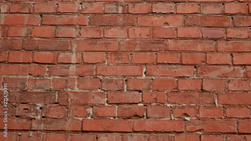 Old surface of red brick wall as texture or background Old surface of red brick wall as texture or background