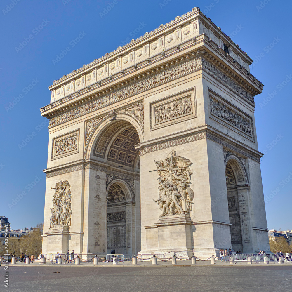 Scenic view of Triumphal arch (Arc de Triomphe) in old touristic historic city Paris. Beautiful summer happy look of one of most popular tourist attractions in ancient capital of France