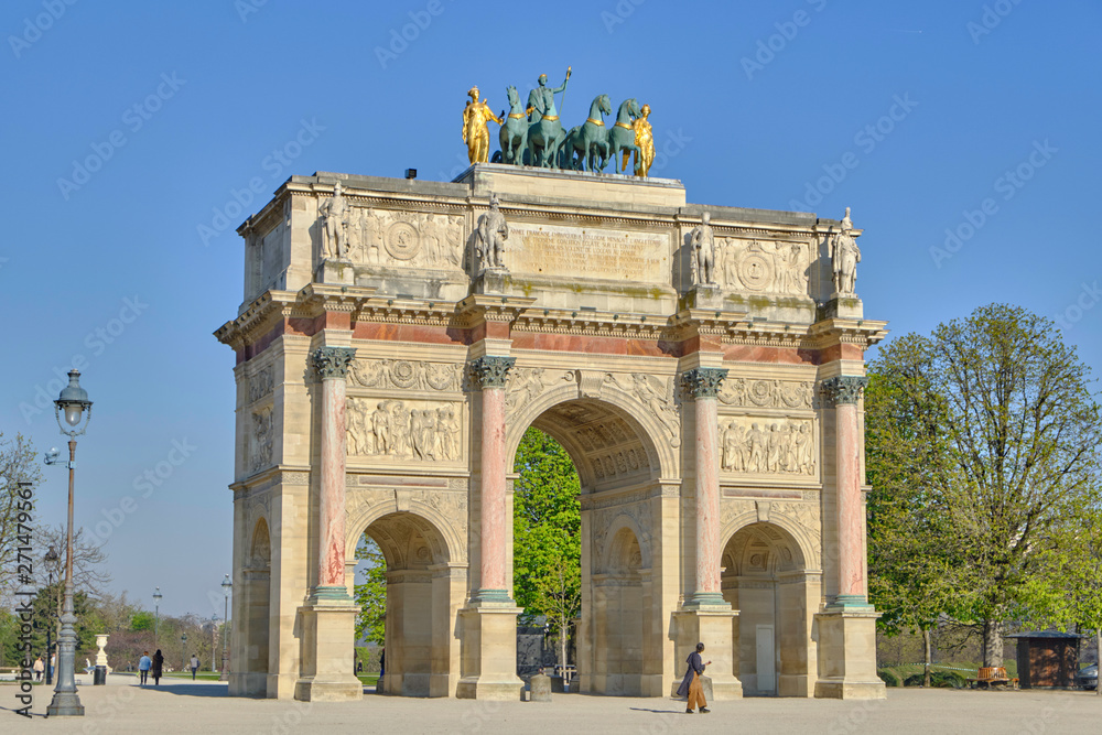 Scenic view of Triumphal arch (Arc de Triomphe) in old touristic historic city Paris. Beautiful summer happy look of one of most popular tourist attractions in ancient capital of France