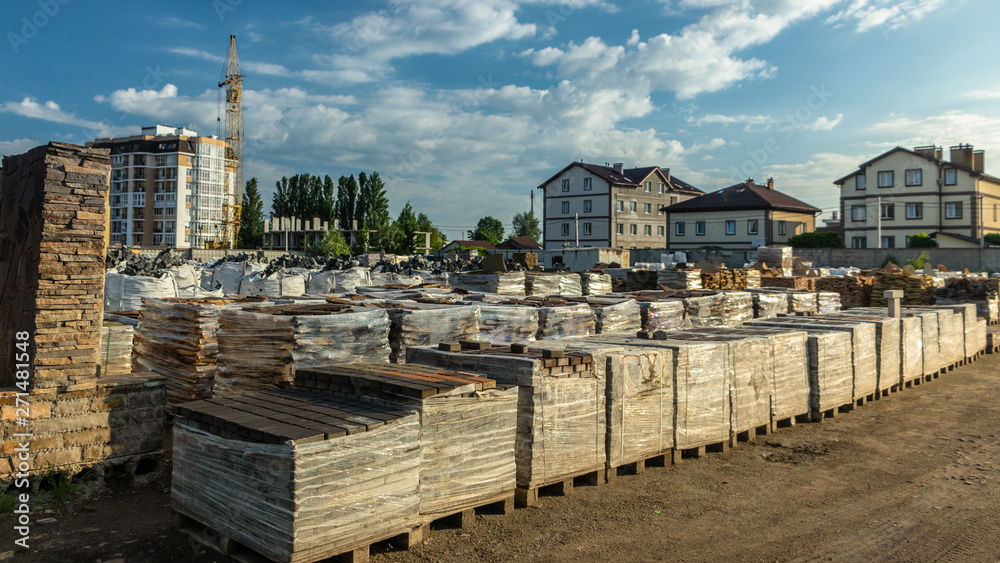 Pallets with natural facing stone and cobblestones