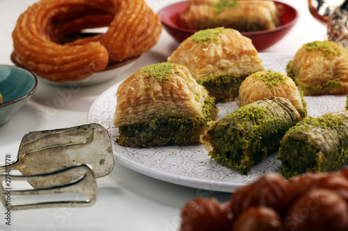 Middle eastern or arabic dishes. Turkish Dessert Baklava with pistachio on dishes