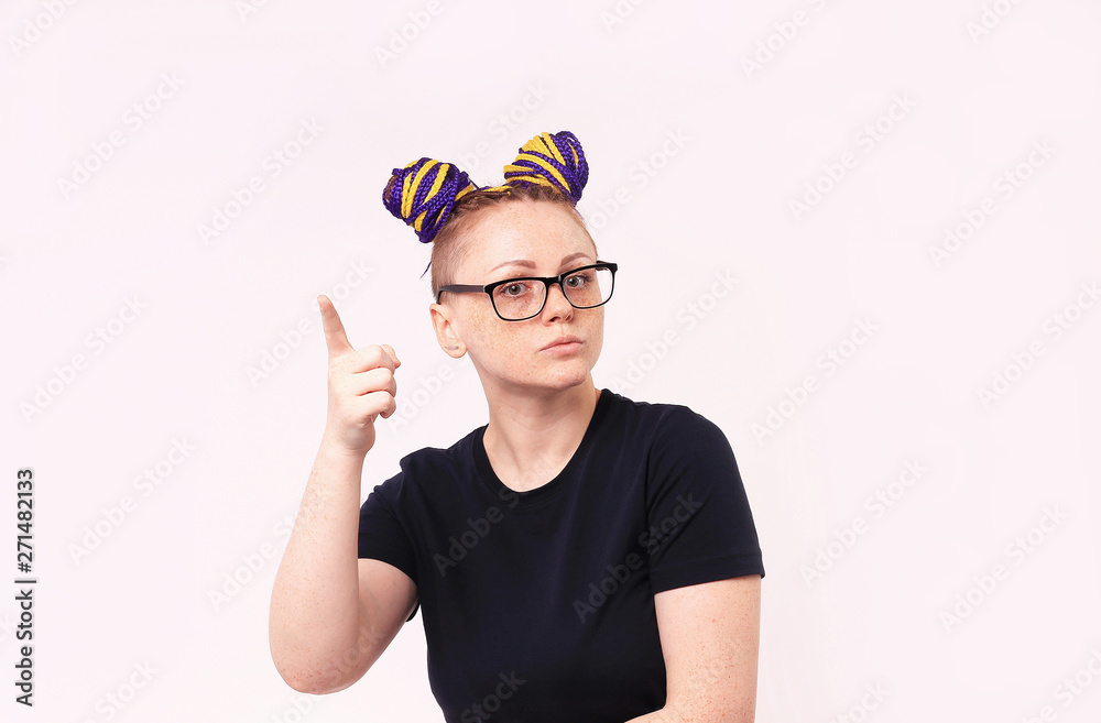 Portrait of woman with a variety of emotions on the face. Standing over white background. Woman has dreadlocks on her head, she has freckles on her face. Portrait of woman with a variety of emotions on the face. Standing over white background. Woman has dreadlocks on her head, she has freckles on her face.