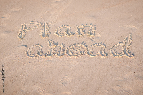 The Words "Plan Ahead" Written in the Sand