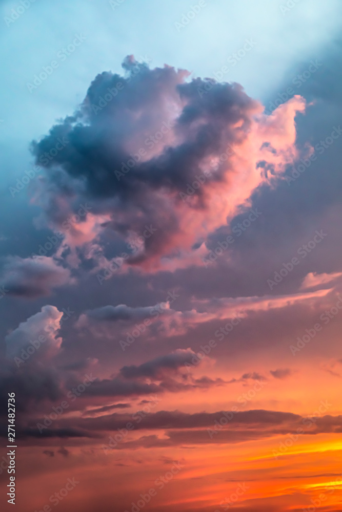 Sky Colors - Dramatic clouds populate an intensely colorful sunset sky as stormy weather clears.