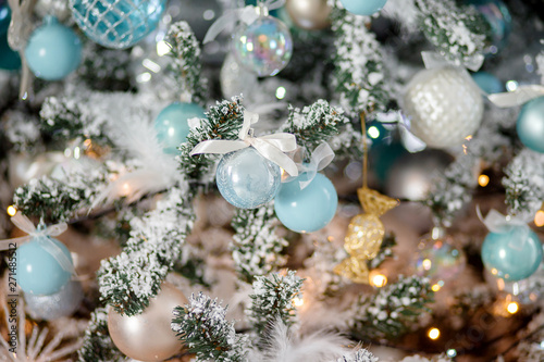 Closeup Christmas tree toy light background