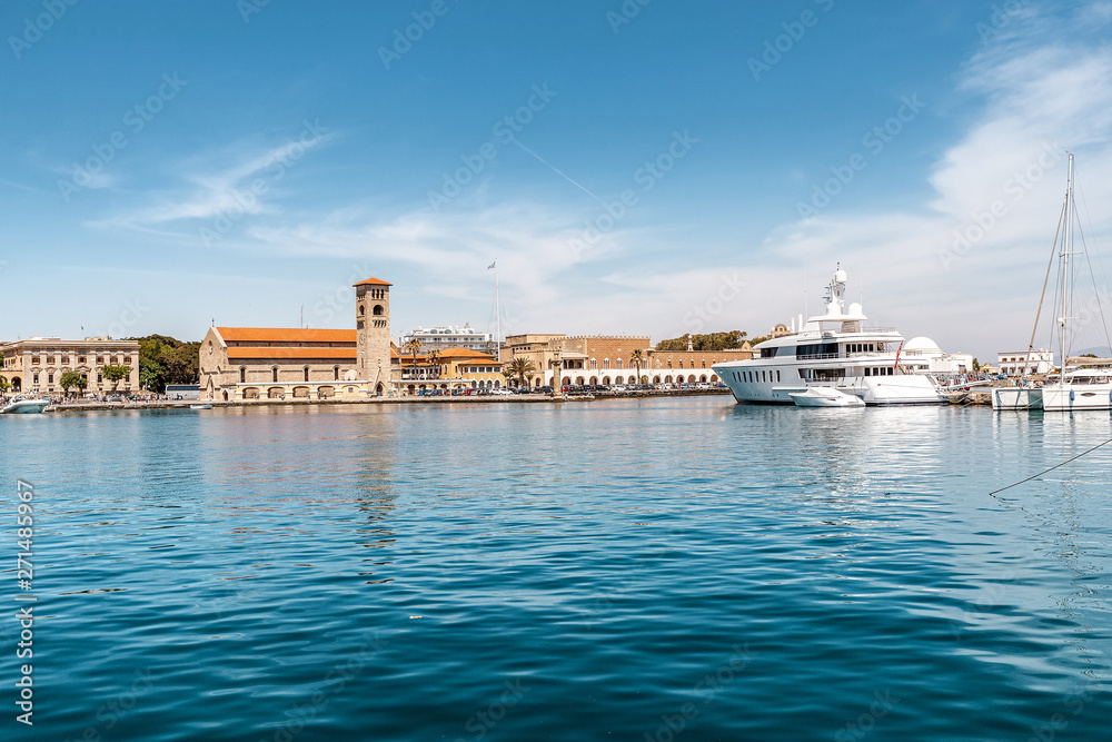 Famous tourist landmark - Mandaki sea port in Rhodes island, Greece