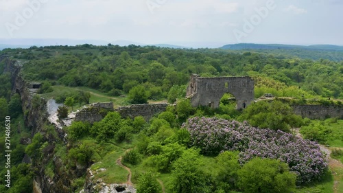 Wallpaper Mural Aerial nature video. Flight in green forest mountain. Mountain old ruin cave town of Mangup. Torontodigital.ca