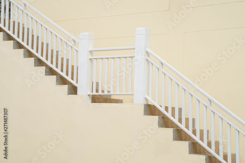 vintage white Stairs on wood and white cream color wall side view