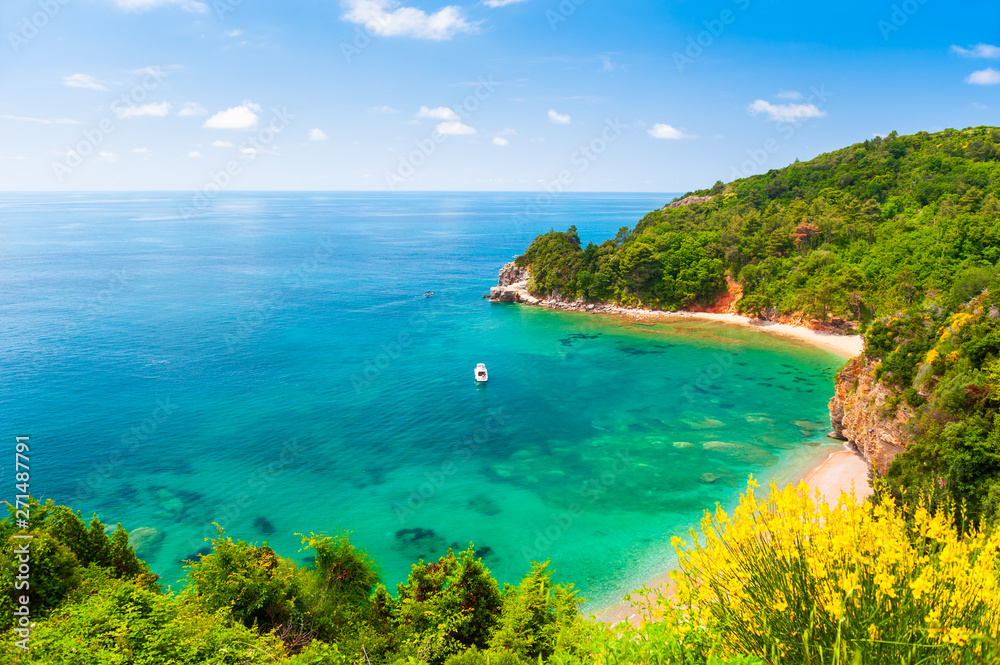 Beautiful beach with turquoise water in Budva, Montenegro. Adriatic sea. Famous travel destination
