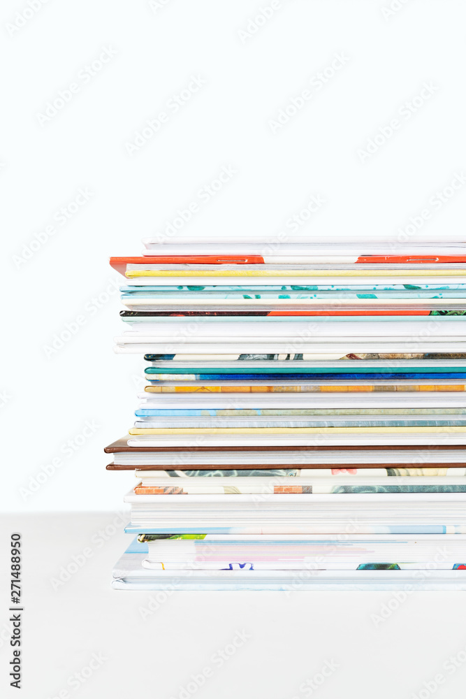 Close view of Stack of children's books on a pastel blue background. Close view of Stack of children's books on a pastel blue background.