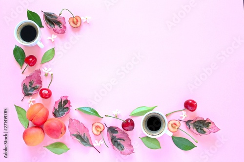 Coffee with fruits and follies on pink background. Top view with copy space. Flat lay style. Summer concept background. photo