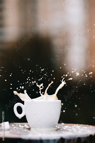 cup of coffee with milk splash