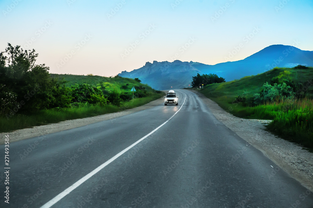 Fototapeta premium SUV Rides the Highway