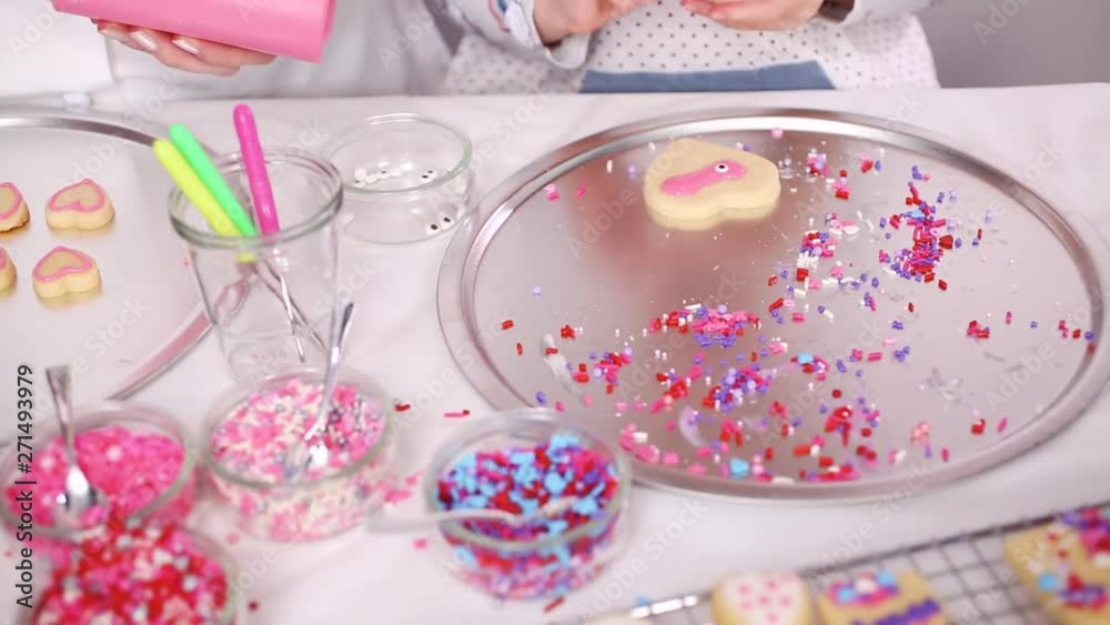 Step by step. Decorating sugar cookies with royal icing and sprinkles for Valentine's day. Step by step. Decorating sugar cookies with royal icing and sprinkles for Valentine's day.