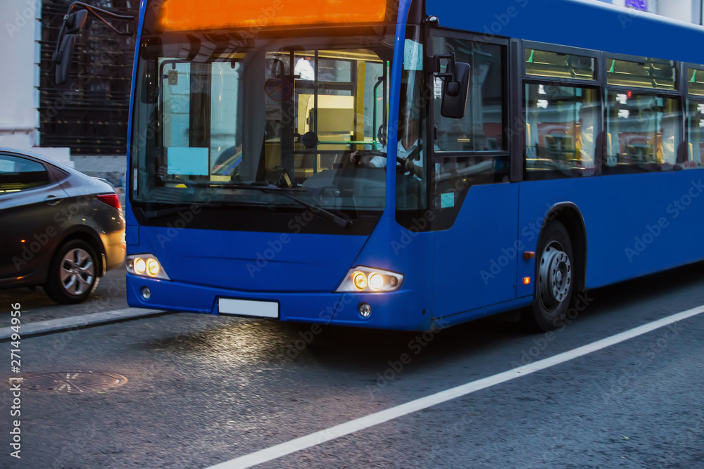 Passenger bus moves straight along city