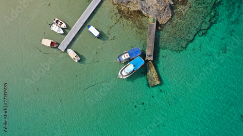 Aerial drone top view photo of turquoise organised beach forming a small heart shaped lagoon and mountainous seascape of Stavros, Chania, Crete island, Greece photo