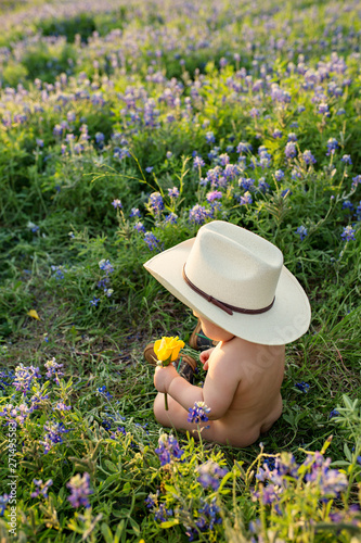 Baby Boy inCowboy hat and Boots in Bluebonnet field