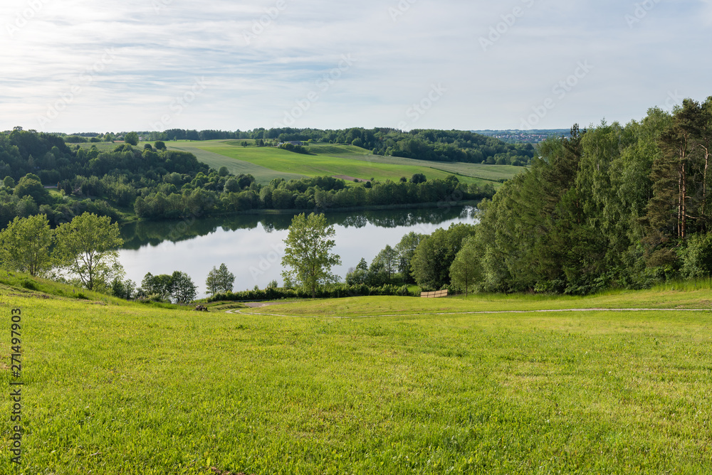 Obraz premium Stunning panorama of the Brodno Male lake and neighbouring hills during spring. Kashubia, Poland