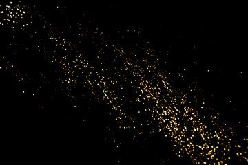 Gold abstract bokeh. Black background. Holyday concept