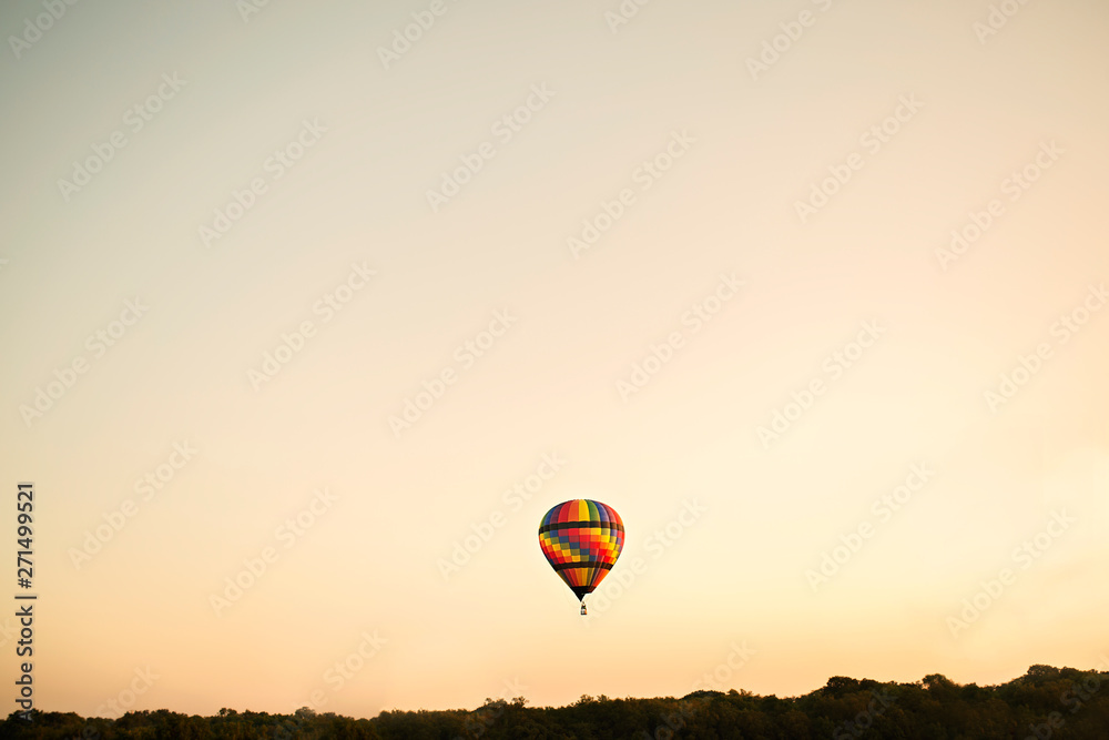 Obraz premium Rainbow Hot Air Balloon With Landscape