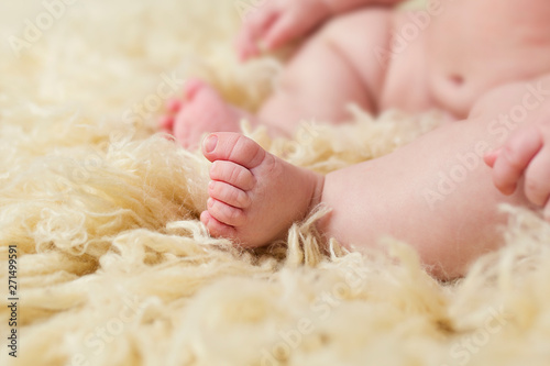 Baby Feet on Cream Flokati Rug