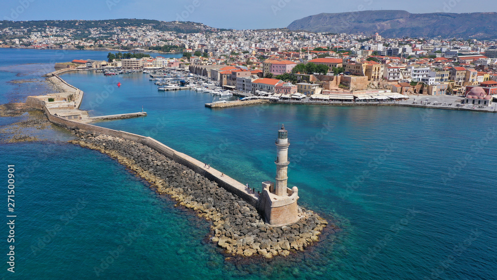 Aerial drone panoramic view of iconic and picturesque Venetian old port of Chania with famous landmark lighthouse and traditional character, Crete island, Greece