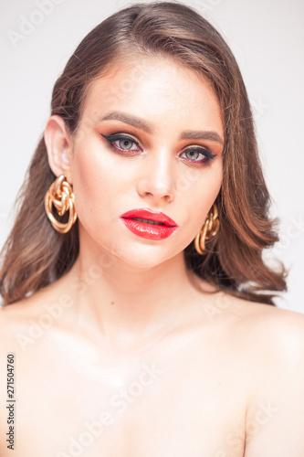 Beauty Makeup. Woman With Beautiful Face And Pink Lips. Close Up Of Beautiful Young Elegant Female Model With Glamorous Sexy Makeup, Soft Smooth Skin And Plump Full Pink Lips. High Quality Image. 