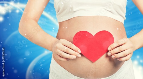 Wallpaper Mural Close up of a cute pregnant belly and red heart Torontodigital.ca